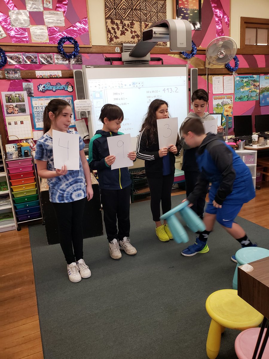 GoodstoneMrs's tweet image. Learning how base tens can be increased by moving the decimal.   We used our bodies as numbers in place values and a stool as a decimal to visualize what was happening.