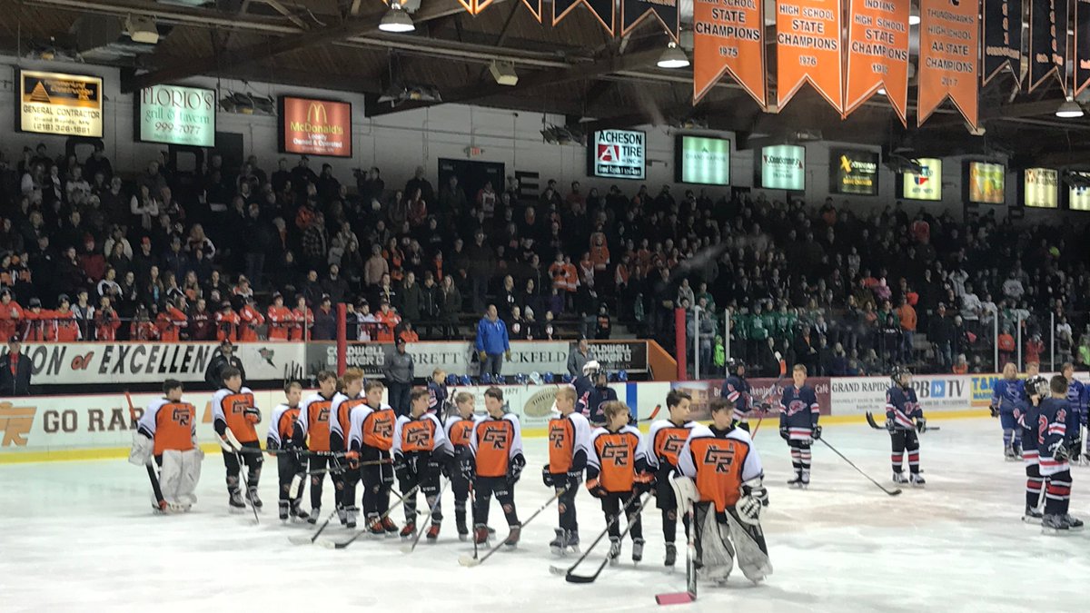 GRhockeyHS's tweet photo. Standing room only.  For Marshall, his family and his team.  Beautiful.  🧡🖤🧡  #laterBader https://t.co/xCljlgYiGq