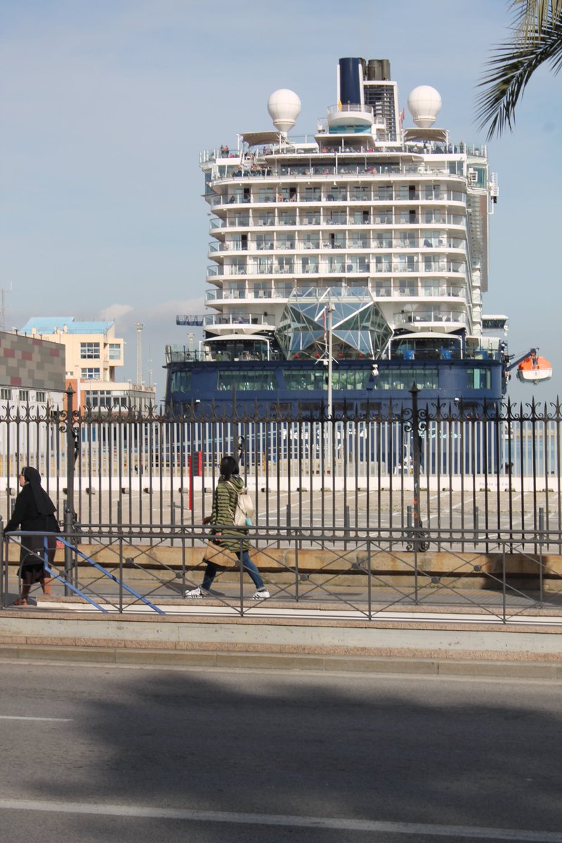 grescoe's tweet photo. Buildings in center of #Cádiz, Spain are 4-5 storeys tall. On my last day, “Mein Schiff,” a monster cruise ship, docked. Streets suddenly filled with packs of tourists—who, complain local business owners, buy nothing. After Carnaval, there are 3 cruise ships like this—every day. https://t.co/E1O4HNFtRX