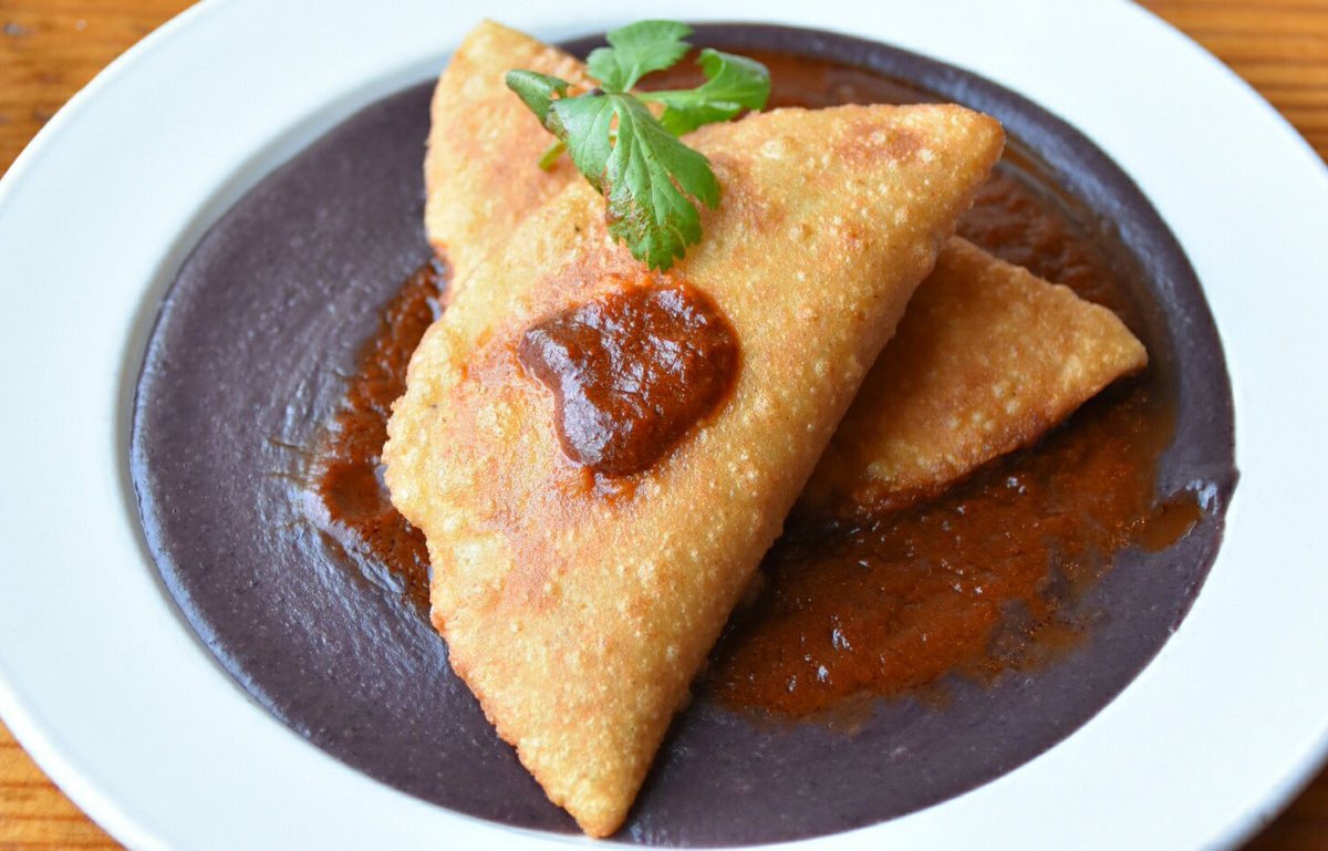 DosPerrosDurham's tweet photo. Did we say #vegan? Did we say #glutenfree? Why, yes we did! Creamy plantain stuffed empanadas with black bean puree and savory guajillo sauce. YUM!
#trirestweek #downtowndurham #authenticmexicanfood #discoverdurham #bitesofbullcity #bullcityvegan #trivegsociety https://t.co/7C9xzB3JPX