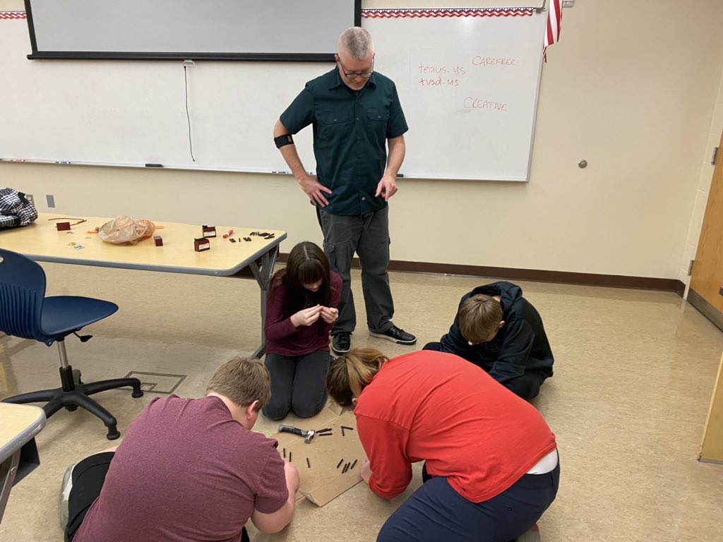 AllisonSwanger's tweet photo. @TeaysValleyWest Mr. Borgman @Stratos assisting 8th graders with stamping letters into metal washers to create bracelets or keychains featuring their “One Word” that describes who they are. #tvwmsgobig https://t.co/LUx4nkvHnm
