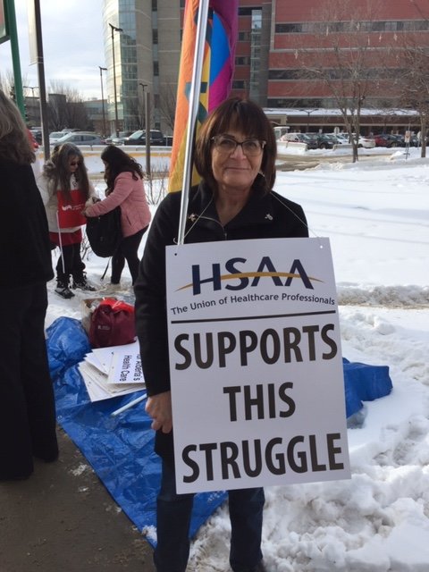 HSAAlberta's tweet photo. #HSAA member @vonnerful attended the @UnitedNurses rally at the U of A Hospital.  January 24, 2020 https://t.co/Io81bORObO