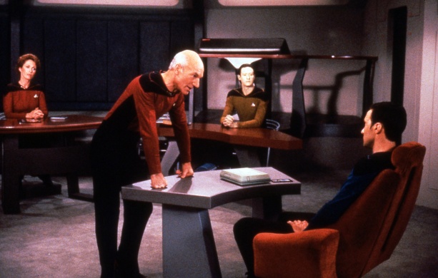 As a refresher, The Measure of a Man was TNG at its hammiest, most thought provoking best.A courtroom drama where the fate of Data hinges on the question of whether he is sentient being deserving of what we’d call basic “human rights.”