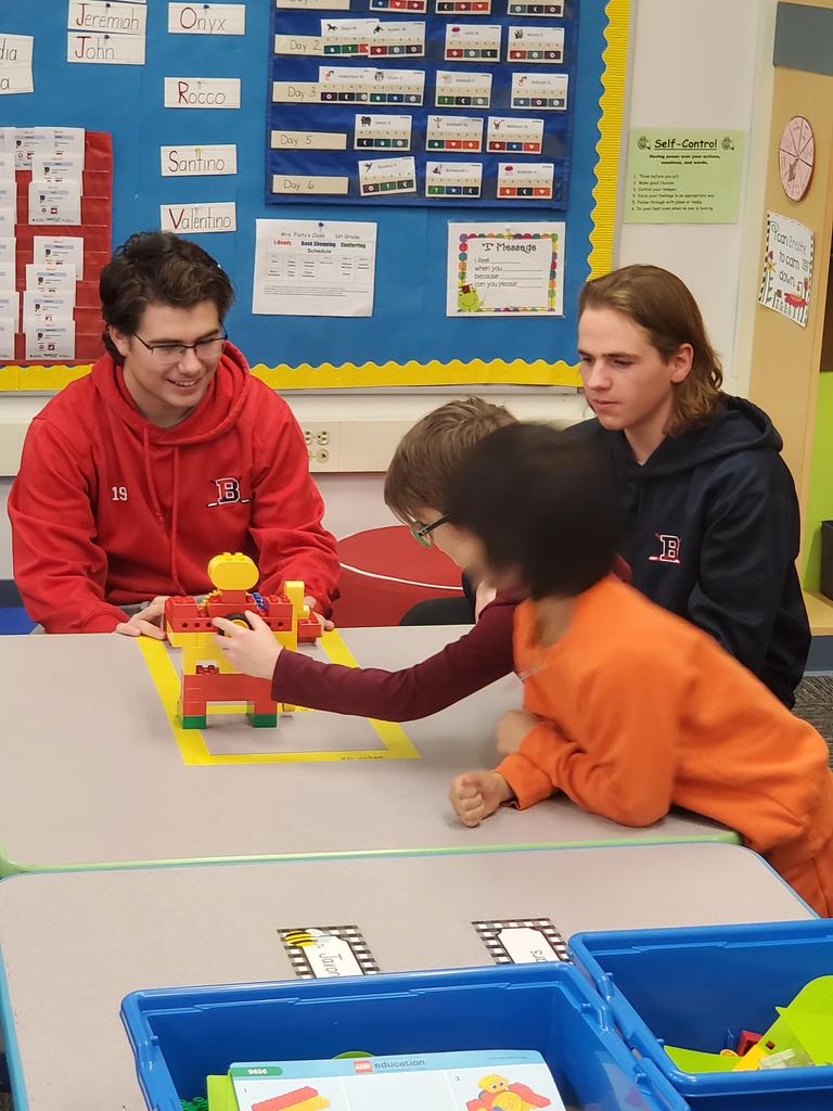 DarioBVazquez's tweet photo. Members of the BHS Hockey Team stopped by this afternoon to visit with students and lend a hand in @Pattifi 1st grade classroom. #BPatriotProud #BCoolidgeCool @DPMiller7 https://t.co/joFDC80VDD