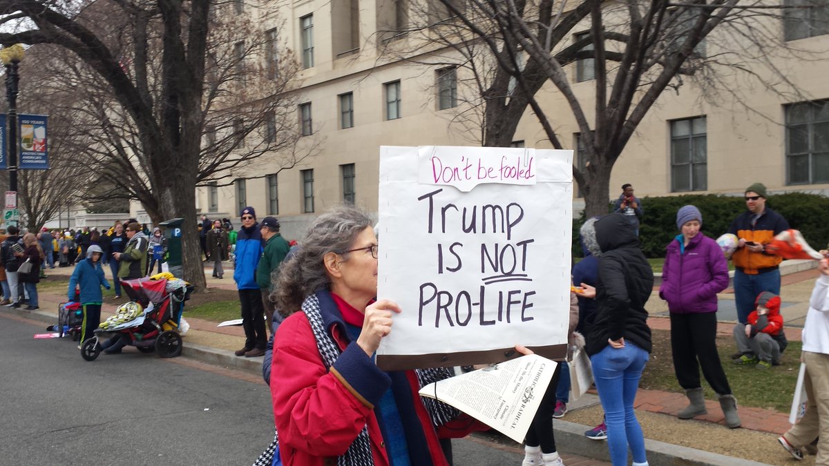 At the March For Life in Washington, DC on January 24, 2020, a woman marches with a sign that reads, "Trump is not Pro-Life."