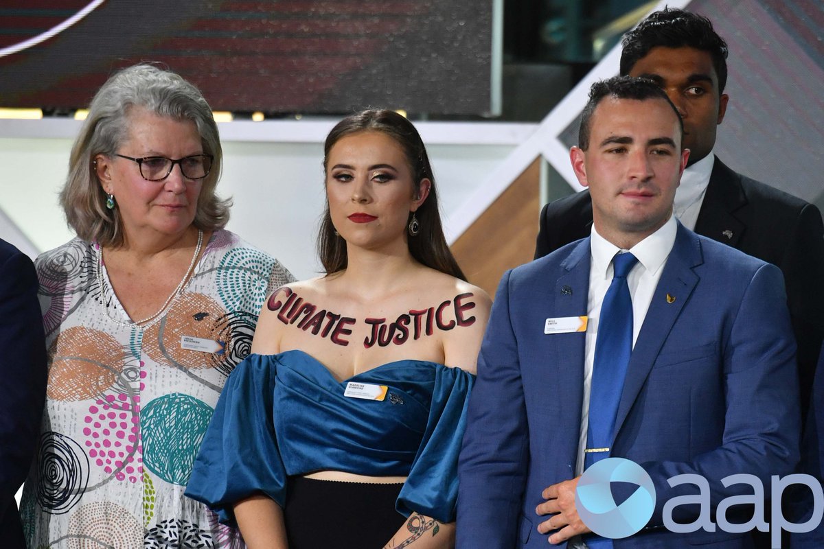 Mick_Tsikas's tweet image. ACT's 2020 Young Australian of the Year finalist Madeline Diamond has painted "CLIMATE JUSTICE" on her upper chest during the 2020 Australian of the Year Awards in Canberra. #ClimateChange #auspol
