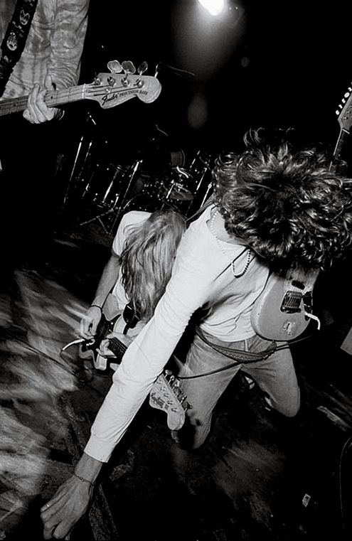 The Art of Album Covers.Mudhoney's Mark Arm and Steve Turner in mid-song collision.Photo Charles Peterson.Used by Mudhoney on their debut E.P. Superfuzz Bigmuff, released 1988.My opinion, this recording was the seminal grunge recording, nobody came close to bettering this