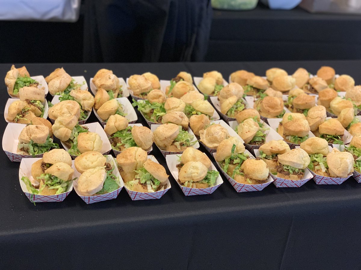 Guests are enjoying a gluten-free cheese bread slider from Porto do Sul. which includes Brazilian meat and special mayo with lettuce. 😋 #NoPassportRequired