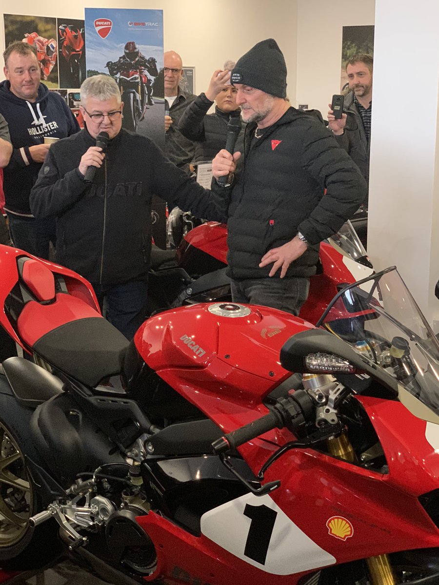 Carl Fogarty collecting V4 annerversary number 01 from Ducati Preston