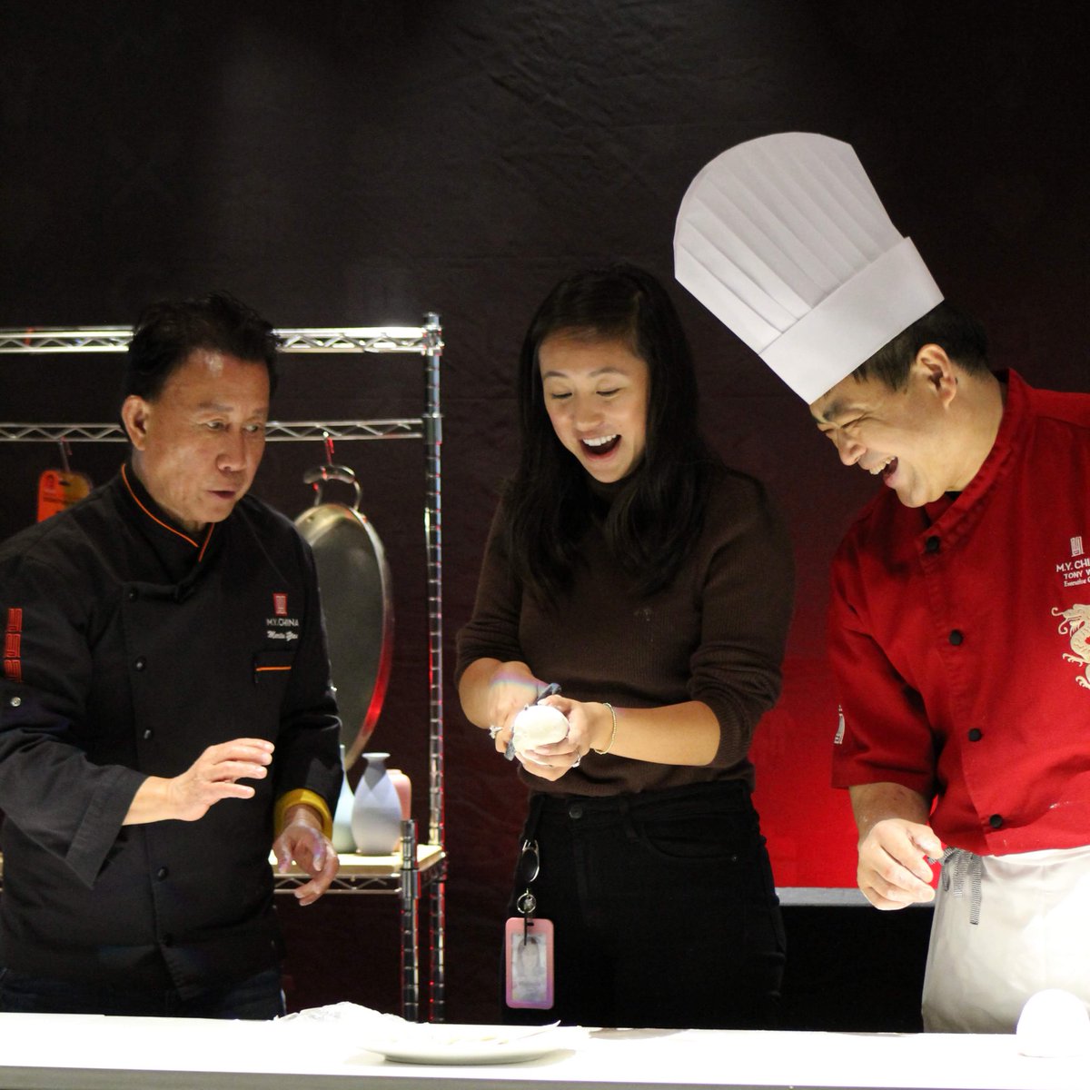 Chef Martin Yan and Chef Tony Wu showing Googler how to pull noodles.