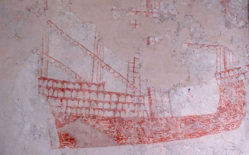 david_castleton's tweet photo. A galleon painted on the wall of Snargate Church, Romney Marsh, #Kent - a secret sign to local smugglers that the church was a safe place to stash contraband. The marsh's isolated churches were good for hiding smuggled items &amp; the parsons often took a share. #history #folklore https://t.co/s9r2XWLvWr