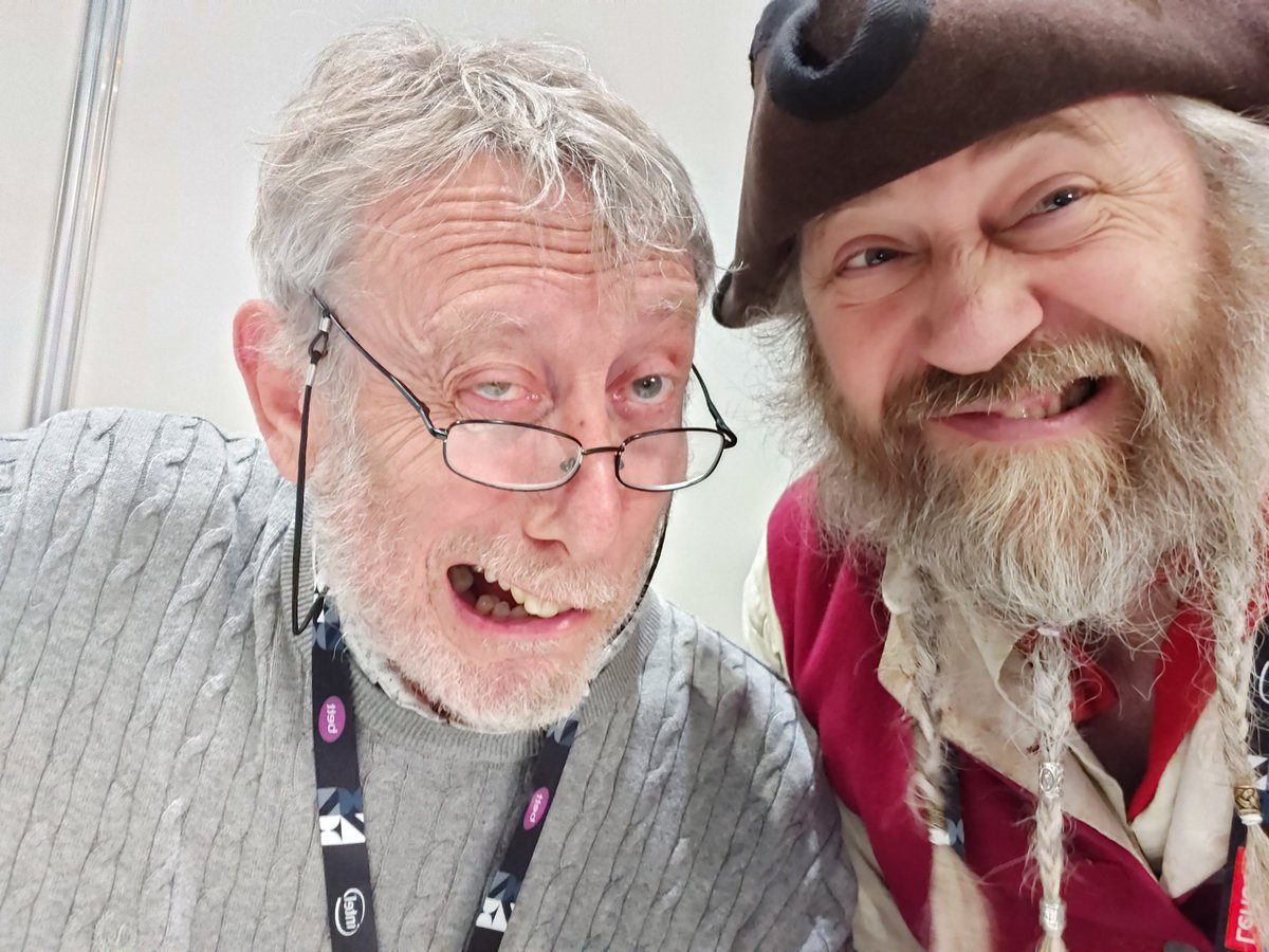 So only got a quick opportunity to grab a selfie with @MichaelRosenYes today. (These were our best pirate grimaces) Michael had a huge queue all day to sign things and we spent most of our day talking Creative Writing and giving kids stories to write. Thanks #Bett2020