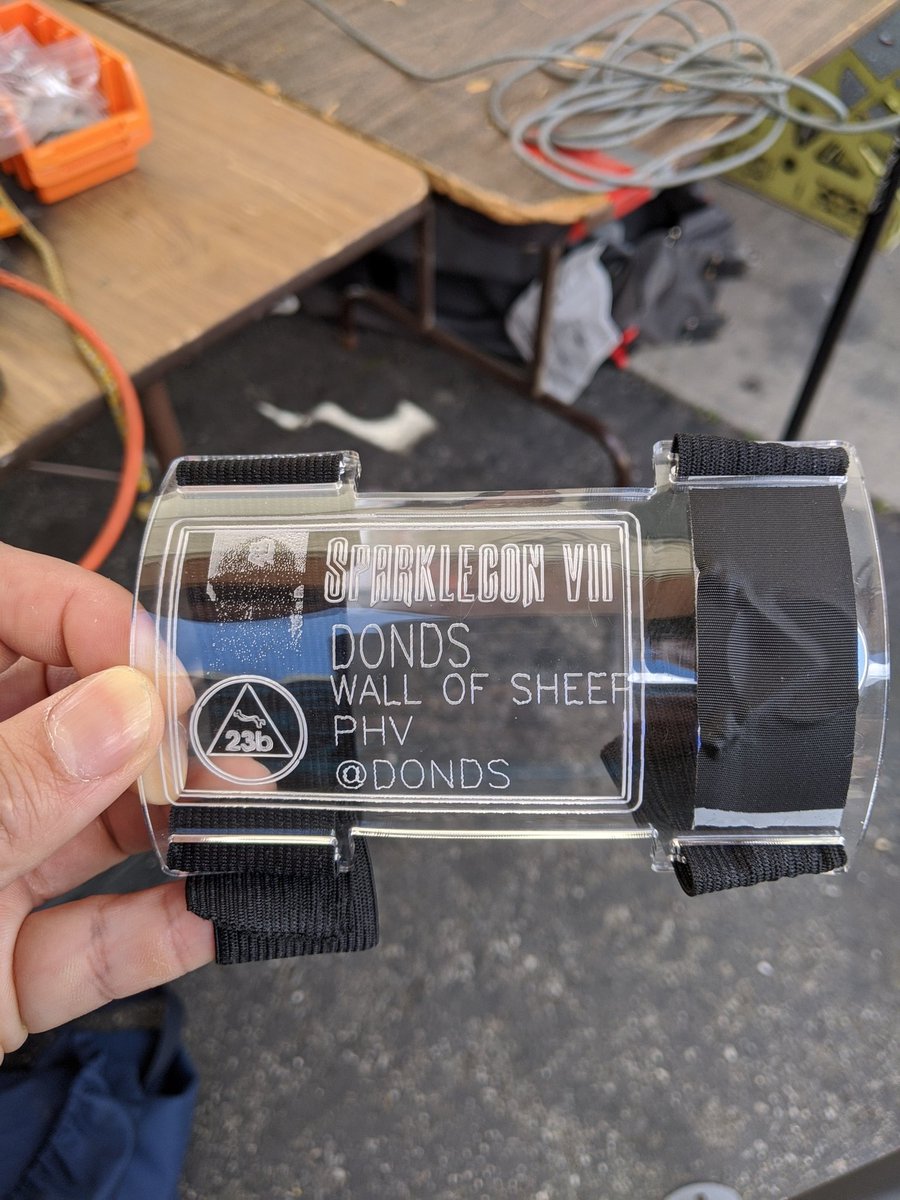 donds's tweet photo. Sparklecon VII. coin battery, leds and laser engraver. #badgelife #kiss https://t.co/ZxEP93d8un