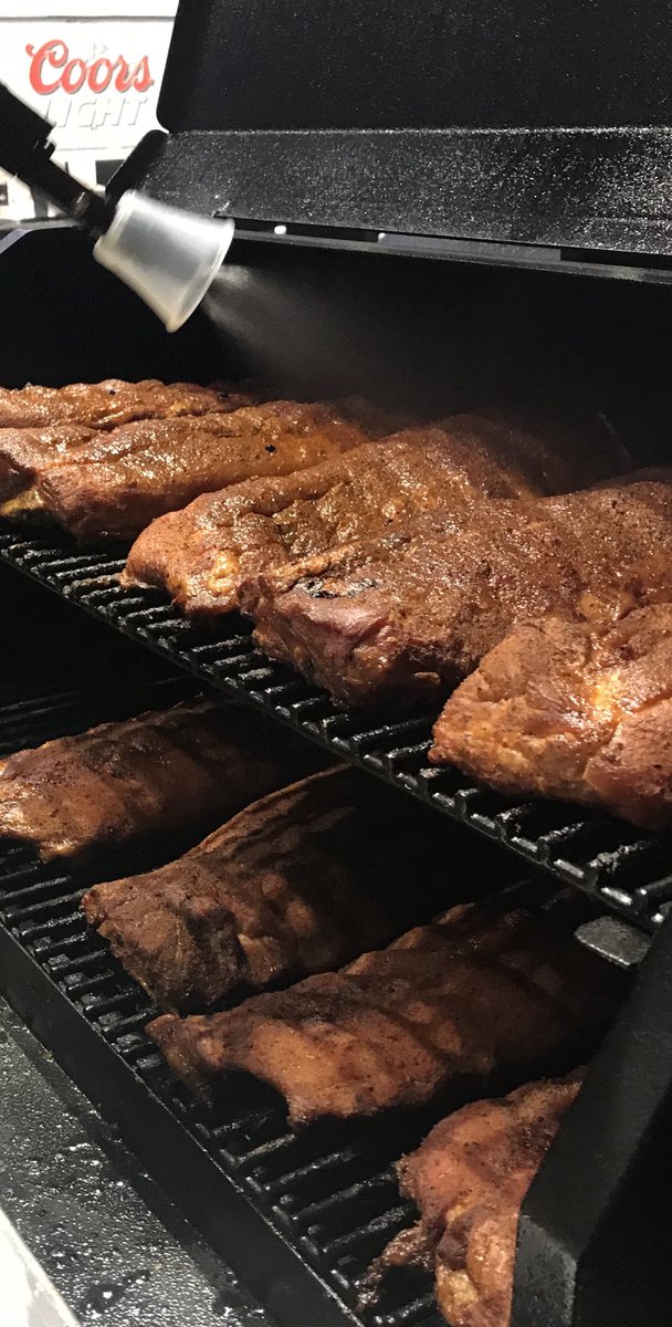 CABakinBBQ's tweet photo. Ribs getting a light mist of sweet, juicy goodness on the Smokin Bro’s smoker.  #whenpigsfly #smokinbros. https://t.co/MU7N1t6Ehn