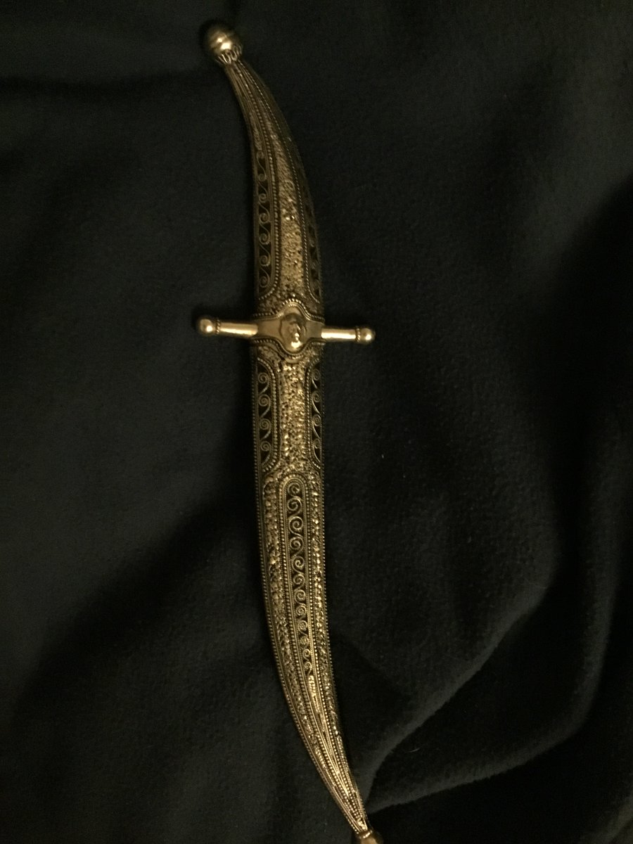 Photo of curved dagger with elaborate sheath 