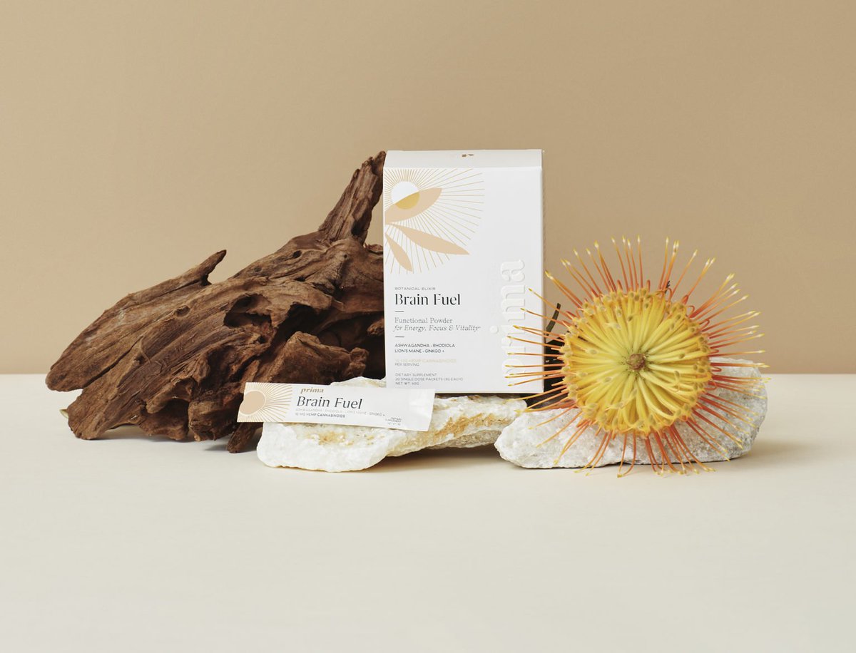 Our reviewers thought Prima Brain Fuel Elixir made a great addition to our morning routine. Photo: The drink mix box and packet posed artfully with a flower and rocks.