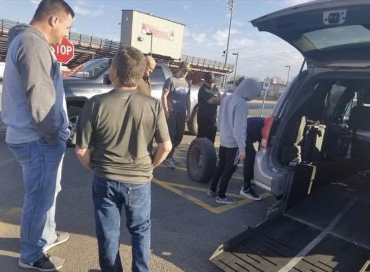 K2CWrestling's tweet photo. Some of the wrestlers helping change out Jaylon’s grandmother’s flat tire after the tournament! #indianup https://t.co/xEFtEQwlps
