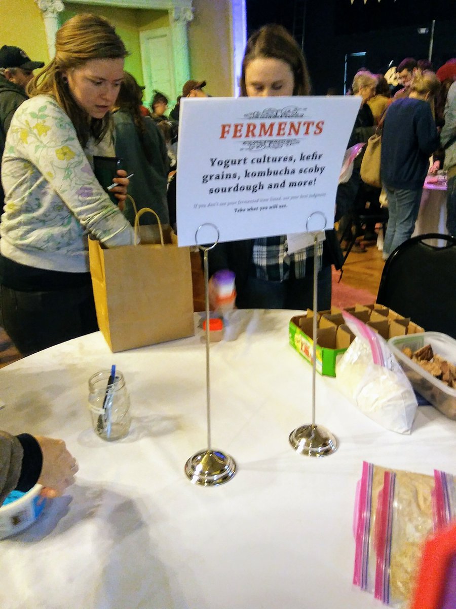 Just one of more than 10 tables of seeds, yougurt, sourdough, etc'starters', pods, etc to take home