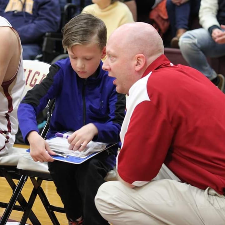 CoachTyFowler's tweet photo. Last night Canyon sat on the bench with the team for the first time. He got to be the water boy, the ball boy, and "the fellas" biggest fan. So grateful these pictures were captured! He loved every minute of it. https://t.co/uqXDwLmAG5