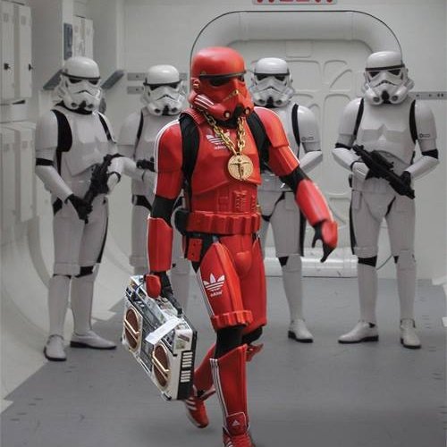 Stormtrooper in red Adidas armour wearing a gold chain and holding a boombox.