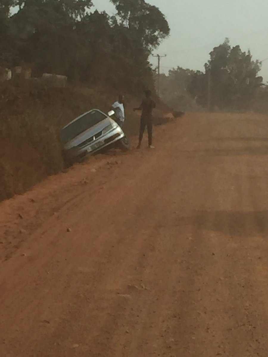 iDEASUG's tweet photo. Kira/Buwaate/Kasangati road, cloud of dust caused them to lose vision and entered the water channel @UNRA_UG @UNRA_ED this road is death trap...wait for a head-on collision #Uganda https://t.co/V3RDGivdML