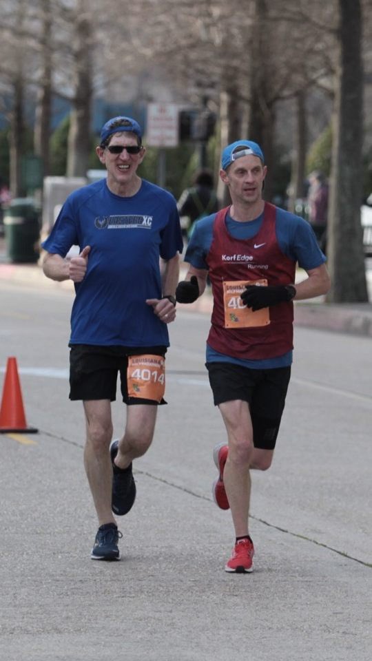 DavidEmeryMCC's tweet photo. At the finish in Baton Rouge with buddy Andy Heim. Special thanks to my coach Lauren Totten who trained me to a 2nd place finish in my age division, 3rd place in grand masters, and 72nd place out of 4000. We were sprinting to the finish for 1.36 half marathon. https://t.co/OR9i72RXSl