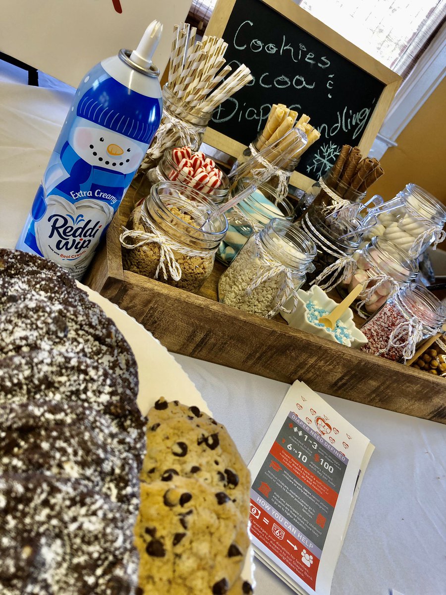 Cookies &amp; cocoa while bundling diapers to distribute through the Lowcountry <a href="/JuniorLeagueCHS/">Junior League CHS</a>.