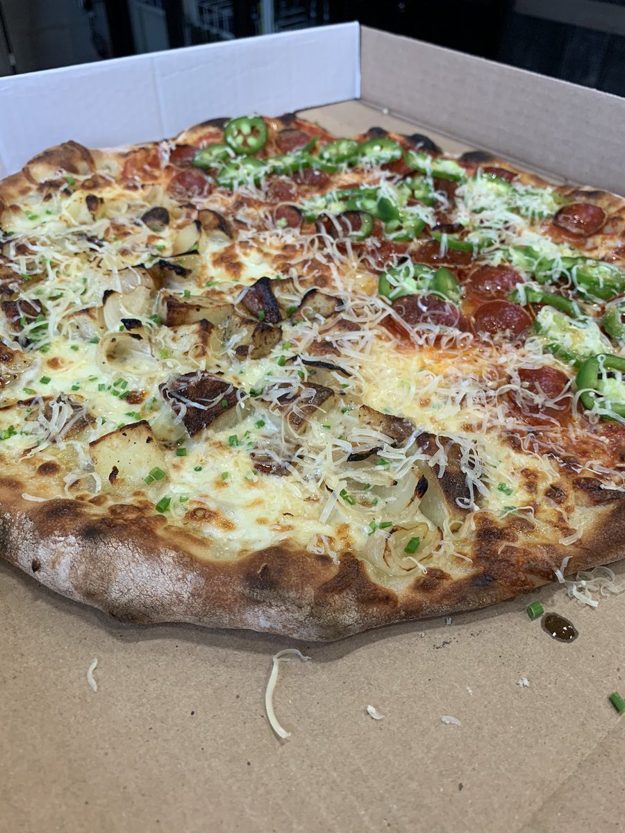 I’ve been away from you too long @Twitter here is a little love from Mark’s Pizzas: Roasted potato, charred onions, chives, rosemary-garlic olive oil. Other half is pepp, pickled jalapeños and hot honey. Ya welc #pizza
