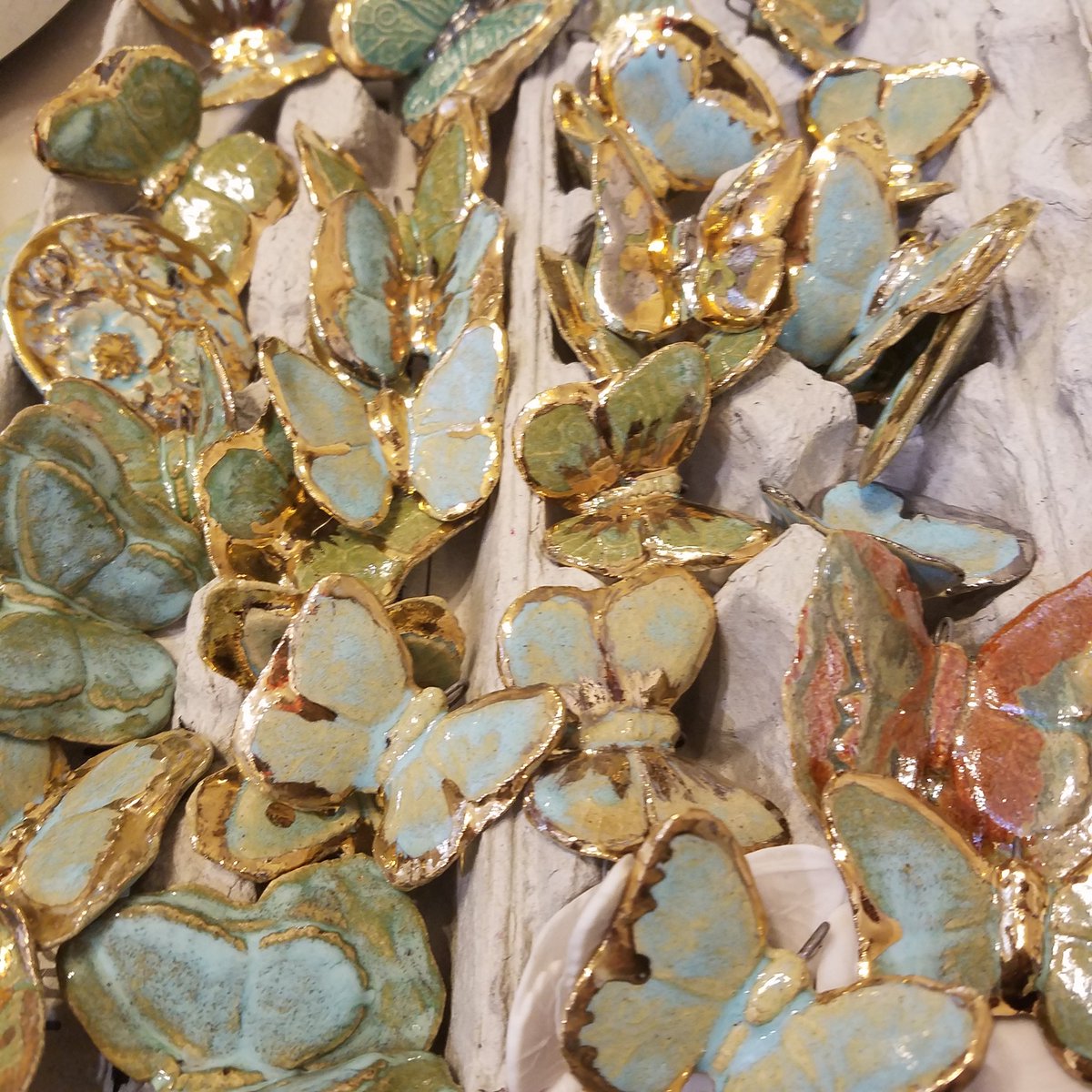 BurnCeramics's tweet photo. Gathering my ceramic golden butterflies today for @NorthernClayCtr at #NCECA2020 Exclusive Edition! Look for them this March at NCECA. #ceramic #claynecklace #butterflyjewerly https://t.co/u2OxQcaD2D