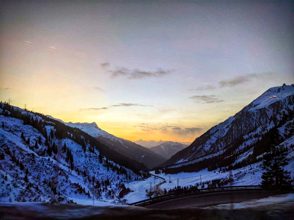 A warm sunset with cold snow covered mountains