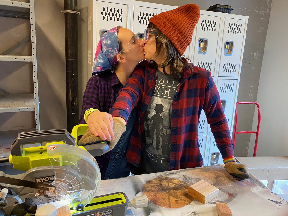 Kissing while fondly holding our miter saw