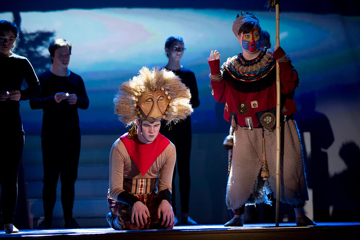 Actors on stage in the Lion King