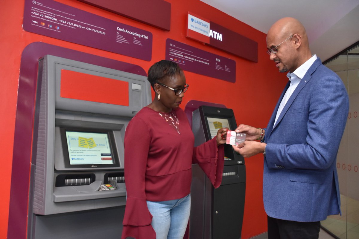AbsaKenya's tweet photo. Jeremy Awori, Managing Director of Barclays Kenya, soon to be Absa, explains features of the new vertical Absa credit and debit cards to Sheila Momanyi, Manager Sarit Centre branch. #journeytoAbsa https://t.co/RjQgBn5QxX