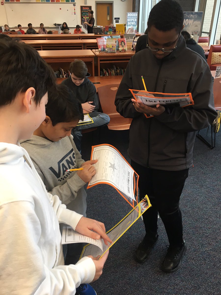 ClassicSassak's tweet photo. It’s a 1920s Meet-N-Greet in the @BAM_Library today. 7th grade Ss are researching key individuals, slang words, and accomplishments of the 1920s. They are also playing bingo. Thanks @ajcouse &amp; @melissalarson74 for dressing up as authentic #Flappers! https://t.co/vtIdORb45l