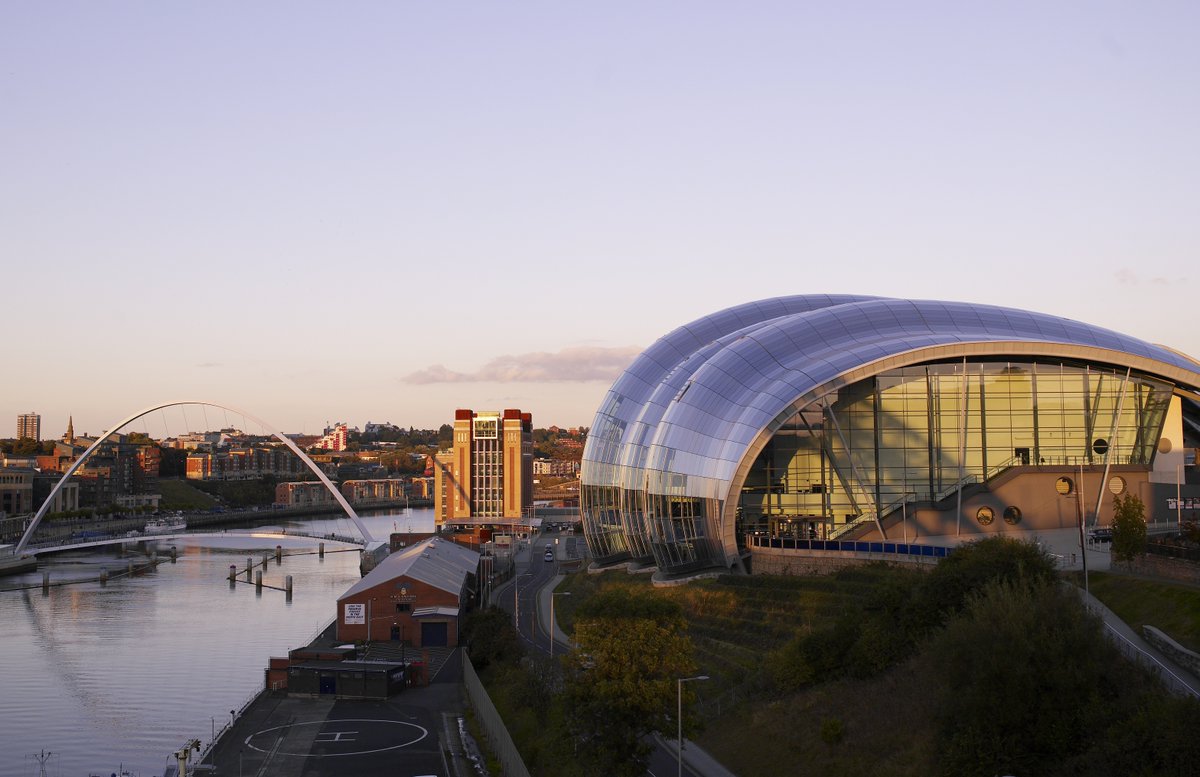 A photo of the River Tyne with the Sage Gateshead in the foreground and the Baltic Art Gallery in the background