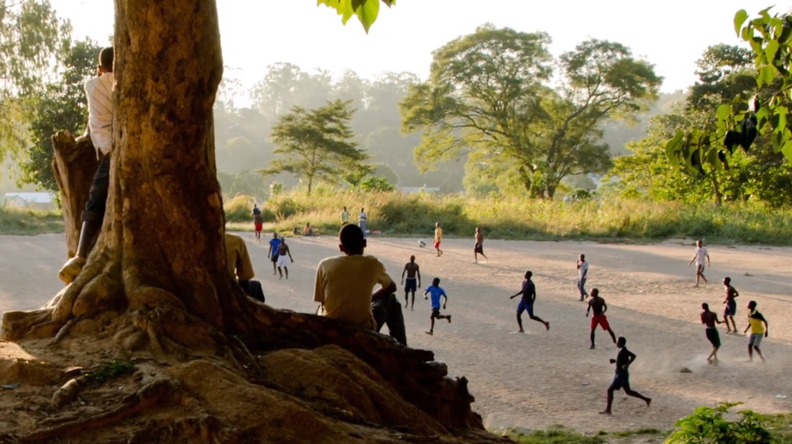 Youth playing soccer in Malawi