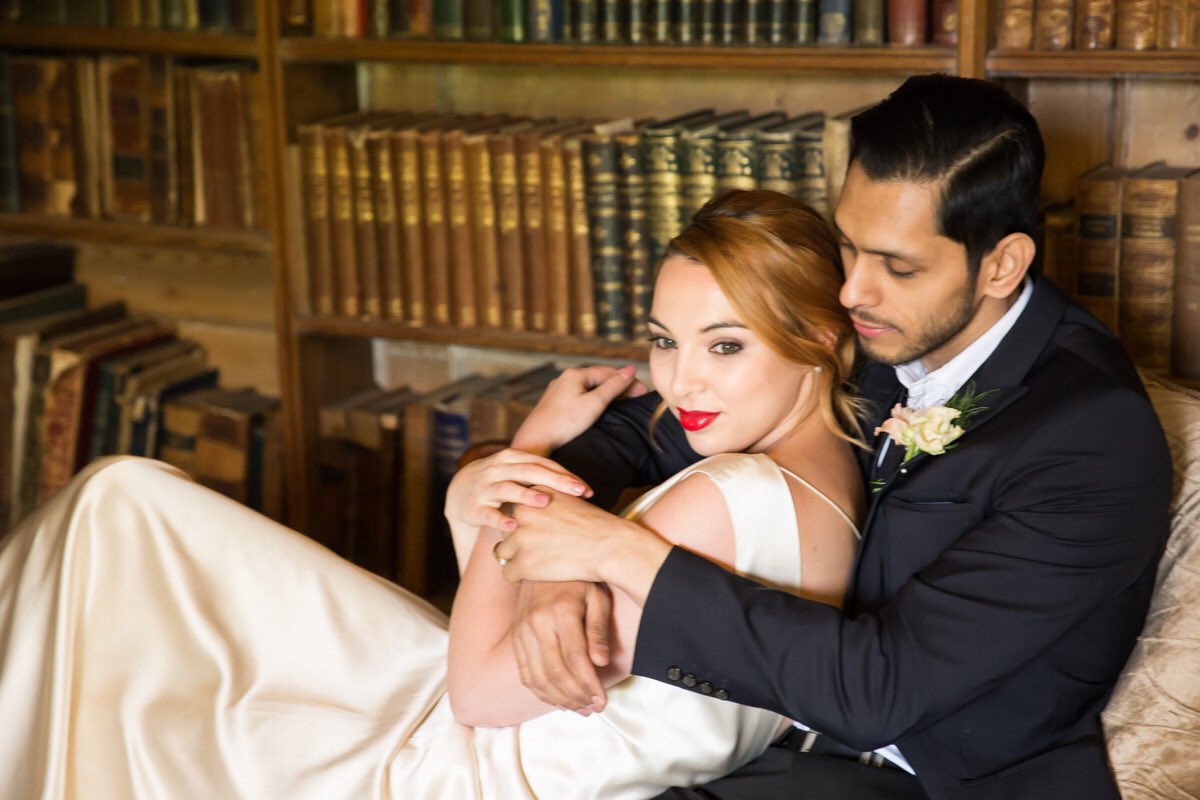 Bride and groom in old library