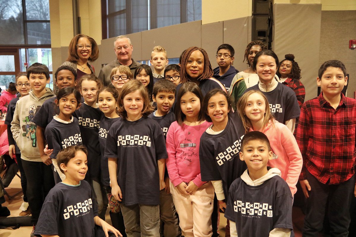 Mayor Kenney posing for a photo with a large group of participants