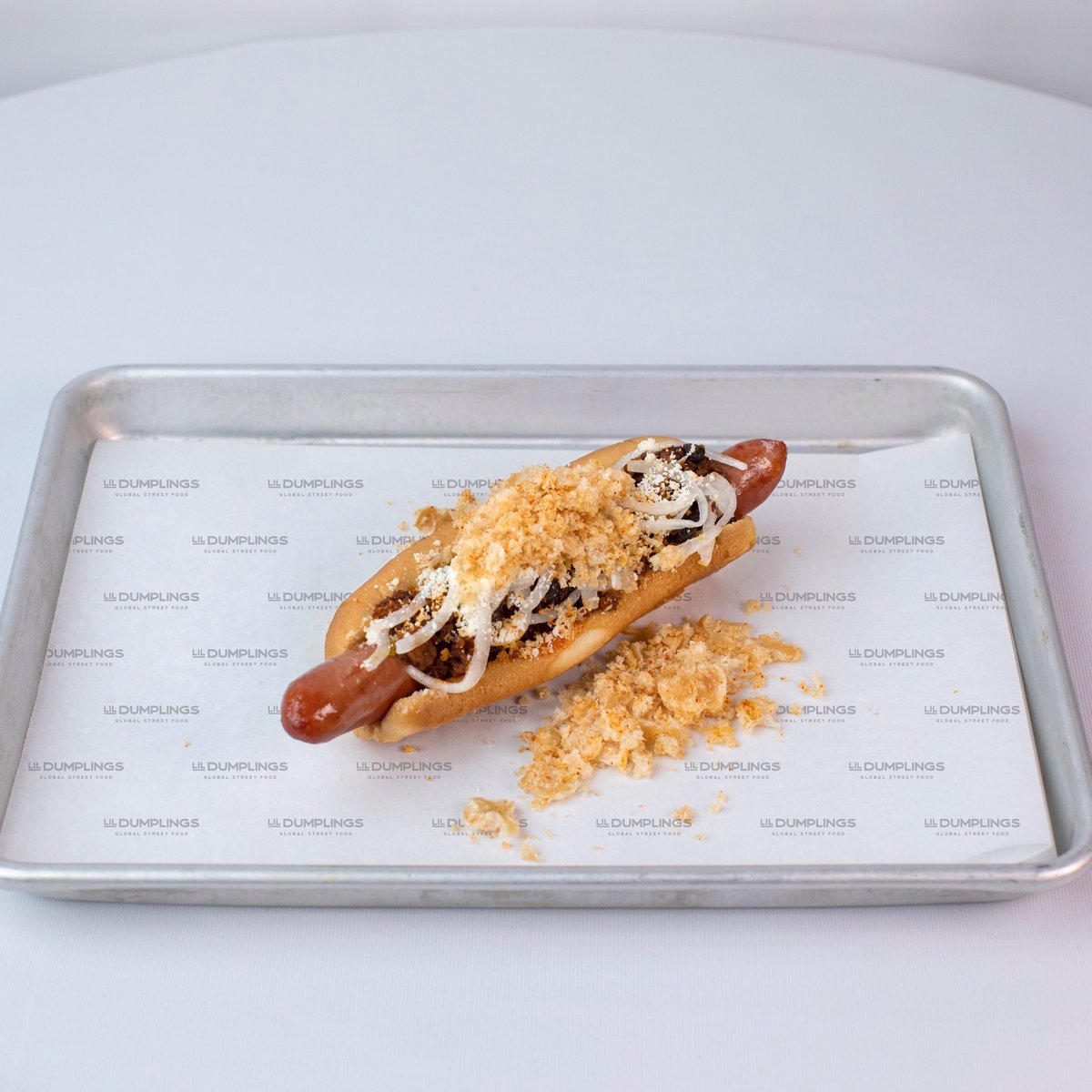 Fishers_Kitchen's tweet photo. The countdown is on! Five days until the #FishersTestKitchen is open 🤩 For now, dream of this Lamb Chili Cheese Dog from Lil’ Dumplings 🤤 https://t.co/09XiL65WAA