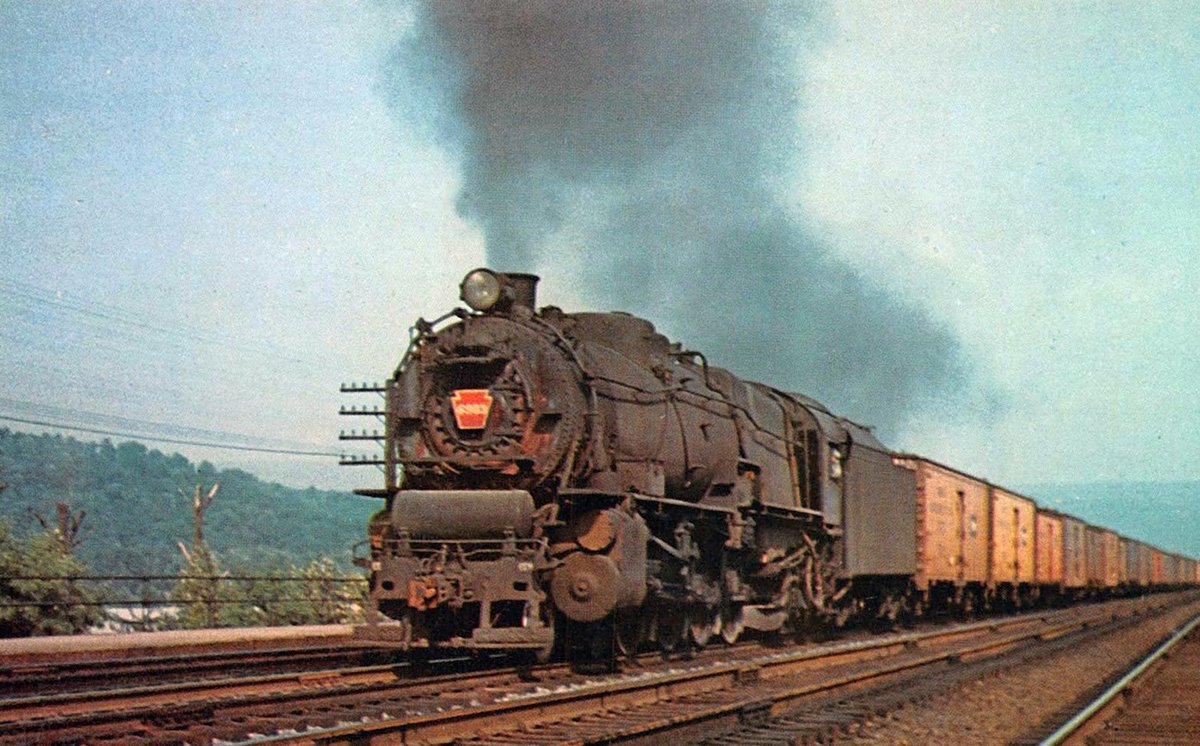 americanrails's tweet photo. Pennsylvania 4-8-2 #6903 (M-1) hustles a hotshot freight of refrigerator cars westbound through Mt. Union, Pennsylvania during the 1950's. Stephen Bogen photo. https://t.co/JpNqeyYarh