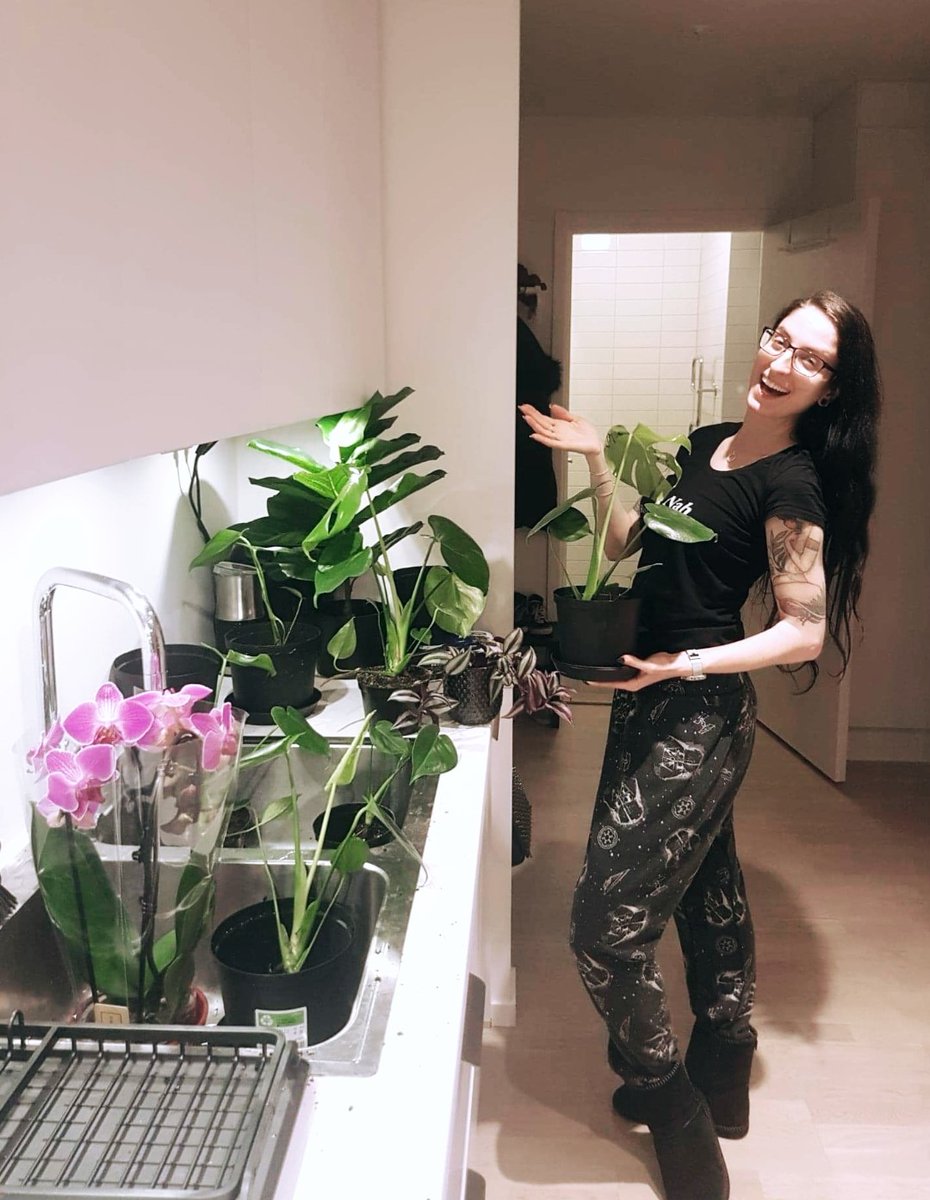 Me happily fixing up 10 new plants in my kitchen.