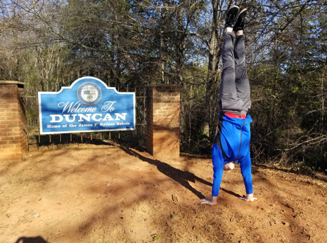 SCWS1's tweet photo. Zach English, SCWS senior, is an elite gymnast training for the Olympics. He is in Dr. White's 4A English course. The course revolves around the theme of hometown and what that means to you. Zach thought that showing his hometown while doing handstands would be fitting. https://t.co/nYI3yoOOqx