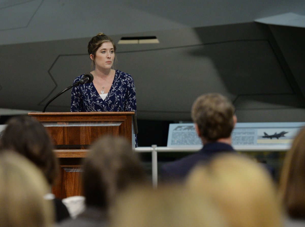 A speaker addresses the crowd at the bill signing.