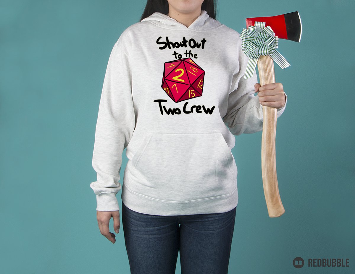 A person in a grey sweatshirt holding a fireman's axe. The design on the sweatshirt says "shout out to the two crew" and has a drawing of a twenty sided die having rolled a two.