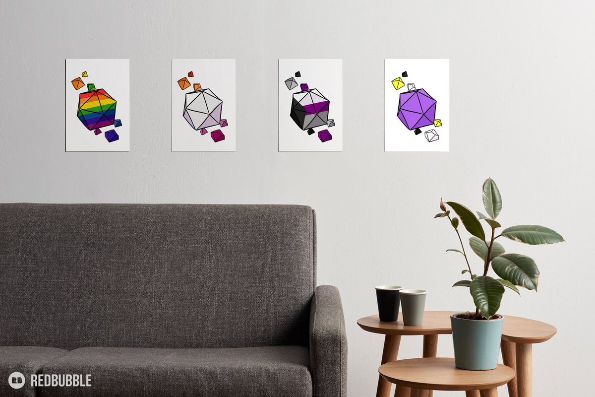 A wall with four pieces of art hanging on it. The art boards are four drawings of table top role playing dice in the colors of pride flags. The four flags are the standard rainbow, lesbian, demisexual, and nonbinary. The rainbow and demi dice feature the flag's stripes on the large center twenty sided die, while the lesbian and nonbinary dice simply bear the colors of the flags in the dice.