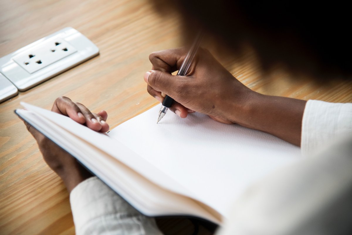 Woman writing in a notebook