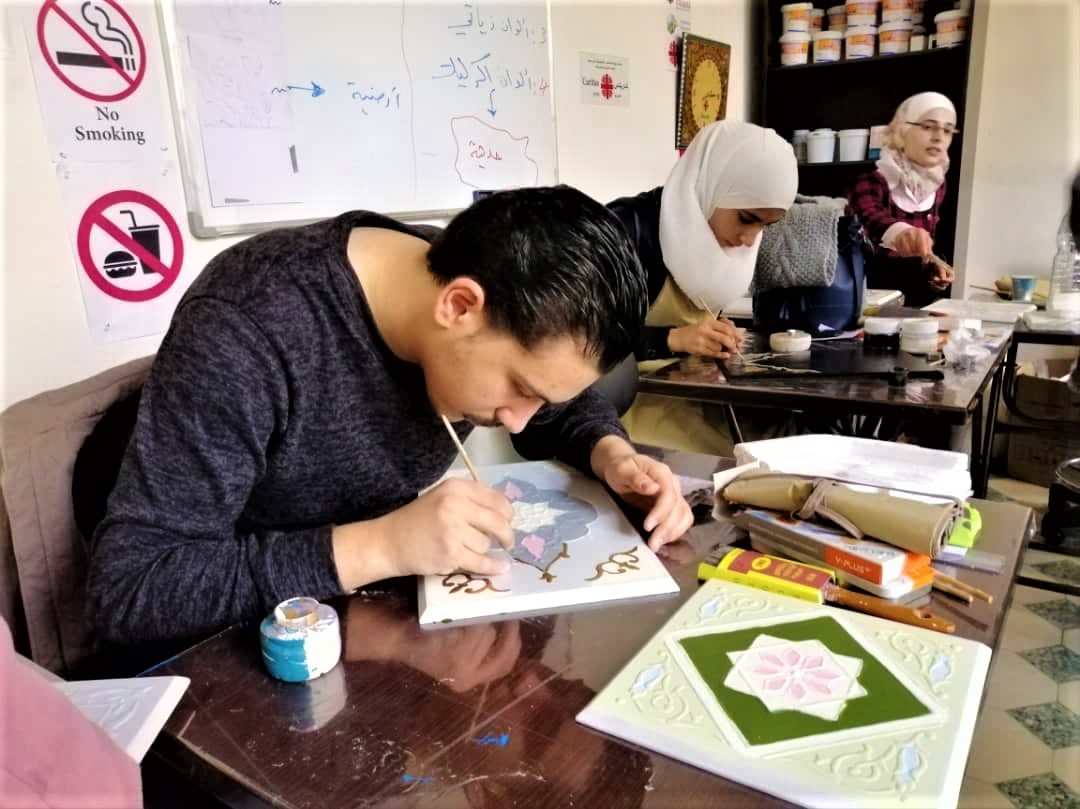 caritassyria's tweet photo. In light of the importance of preserving the Syrian intangible heritage and in an attempt to develop it, seventeen trainees were accepted to participate in the second Al-‘Ajami Art Workshop, held by CS Damascus Office at its Youth Center in Al-Midan area.
#Caritas #SyrianHeritage https://t.co/7q254gd61E