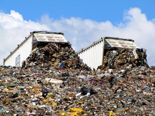 Trucks dumping refuse in a landfill.
(or indiscriminate storage of data)