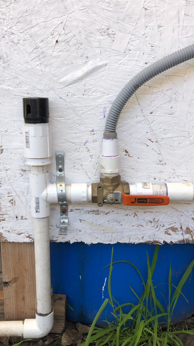 GZzyzyx's tweet photo. greywater 3-way valve. laundry water in the grey tube enters valve. choose to put valuable water in drain OR irrigate a food forest. blue bin behind board is rainwater barrel. #adaptation #adapt #cbfSTEM #climateadaptation #permaculture #greywater #ClimateEmergency https://t.co/kb1FZ3Axkg