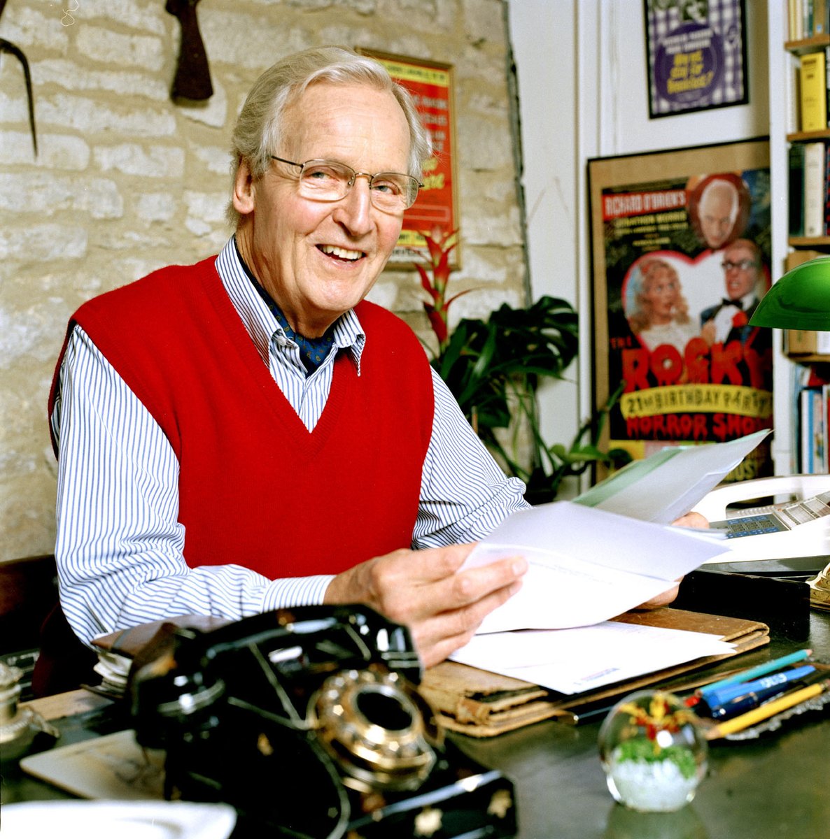 Comic actor and quiz show host Nicholas Parsons, at the desk in his study at home